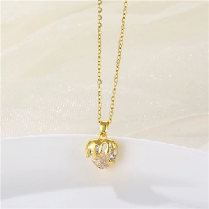 Golden heart-shaped zircon necklace with a unique melting design on a soft light background
