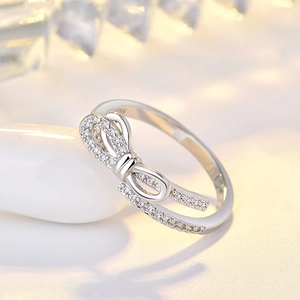 Detailed view of S925 sterling silver stamp on the inner band of the bow knot ring