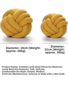 Detailed comparison of 22cm and 28cm yellow knotted sherpa ball pillows on neutral backdrop