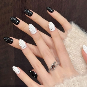 Halloween ghost press-on nails with black polka dots and white 3D ghost relief