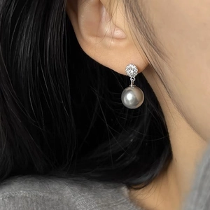 Elegant silver needle earrings with shimmering zircon studs and metallic grey pearls