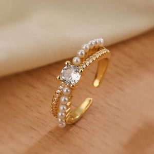 Adjustable gold double-layer open ring featuring a large zircon and white pearls