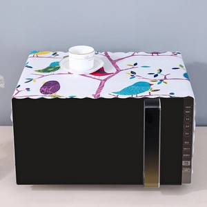 Linen microwave dust cover featuring colorful bird and branch prints with wavy edges