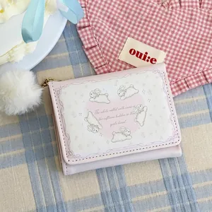 Sweet pink trifold wallet for women featuring cute white rabbits and fluffy plush ball charm
