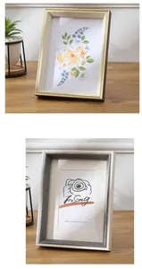 Detail of Nordic wooden photo frames with light wood grain and gray brushed textures