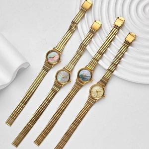 Golden quartz watch set for women with colorful mother of pearl dials and chain straps
