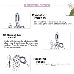 Macro shot of 925 sterling silver charm with scissors, comb and vanity mirror charms