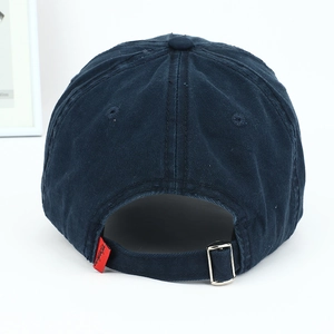 Detail view of the vintage navy blue washed cotton baseball cap with adjustable metal buckle