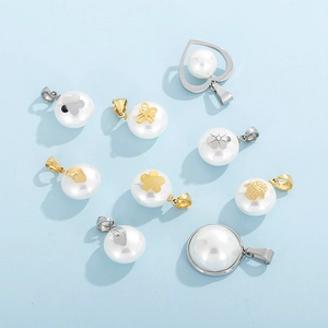 Detailed flat lay of diverse pearl pendants with gold and silver geometric accents