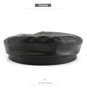 Detail view of black PU leather octagonal hat with fine texture and stitching