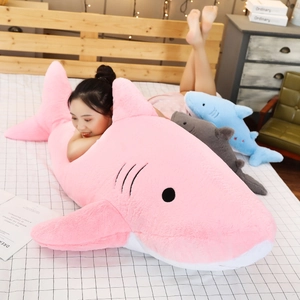 Detailed view of extra large shark plush sleeping bag in soft pink fabric material