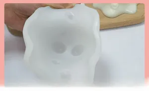 Detailed view of flexible white silicone mold showing soft texture and inner cavity detail