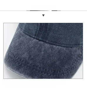 Detail shot of vintage short brim baseball cap with double stitching and washed denim fabric