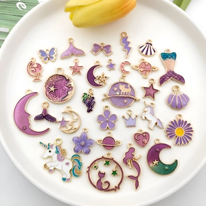 Mix of purple enamel alloy charms featuring moon, star, and unicorn designs for DIY jewelry