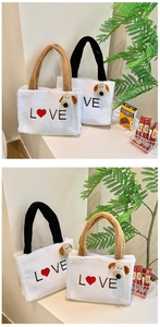 Close-up of white plush tote bags with L❤️VE embroidery and cute dog charms