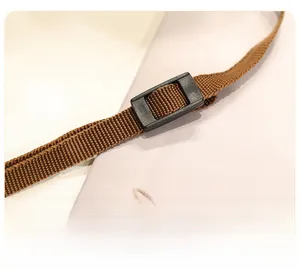 Detail of brown woven strap with black adjustable buckle on dachshund plush bag