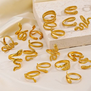 Chic 18K gold plated snake-shaped stainless steel wrap rings on textured stone