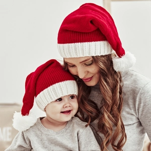 Cozy red Christmas knit hats for mother and baby with fluffy white pom-poms