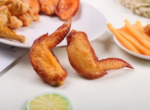 Detailed view of realistic PVC artificial grilled chicken wings for food display props