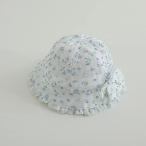 Detail of baby girl floral lace sun hat featuring delicate blue prints and side bow