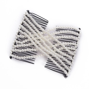 Elegant magic hair comb with white pearls and black metal teeth on a white background