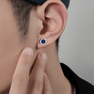 Men's blue crystal stud earring with sparkling zircon halo on ear lobe