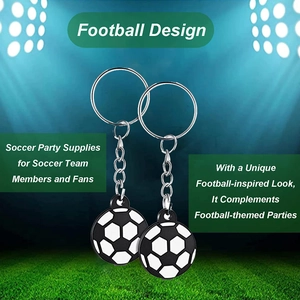 Detail of classic black and white football keychains against a stadium backdrop