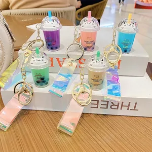 Cute cartoon cat milk tea cup keychains with liquid and glitter in five vibrant colors