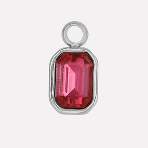 Detail view of a 304 stainless steel geometric pendant with a red rectangular gemstone