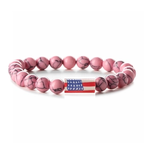 Close-up of pink turquoise beads bracelet with American flag charm on white background
