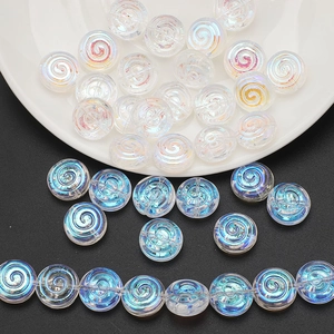 Macro detail of spiral glass beads with iridescent finish for handmade jewelry DIY