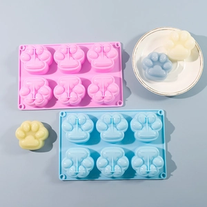 Detailed view of 6-cavity cat paw silicone mold with pink and blue color options