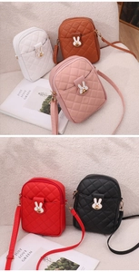 Detail of five mini quilted crossbody bags with cute rabbit charms in various colors