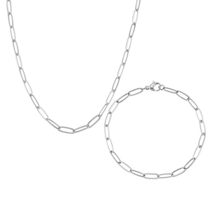 Detail shot of silver paperclip chain necklace and bracelet set in minimalist style