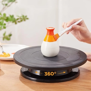 Black plastic rotating cake turntable for DIY baking and crafts with 360 degree rotation