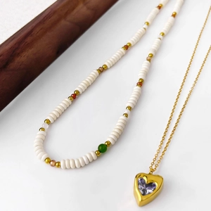 18k gold heart pendant necklace set with dopamine beads and purple gemstone accents