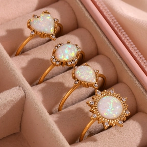Adjustable 18K gold-plated stainless steel rings with opal stones in a pink jewelry box