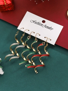 Three pairs of spiral Christmas earrings with gold metal and festive glitter on card