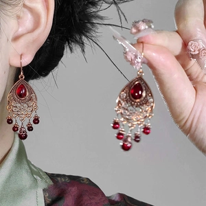 Vintage bronze teardrop earrings with red stone inlay and delicate tassel details