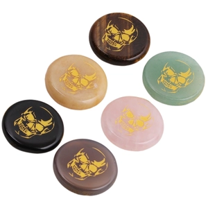Set of 6 oval natural stone figurines with golden skull patterns including tiger eye and quartz