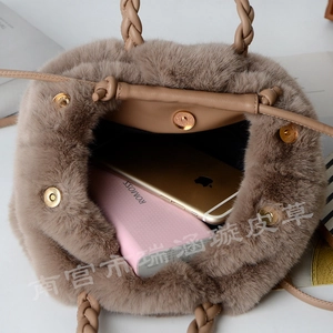 Internal view of khaki faux fur bucket bag showing capacity for phone and power bank