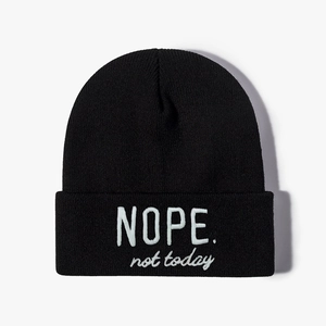 Classic black ribbed knit beanie featuring white NOPE not today embroidery for a casual look