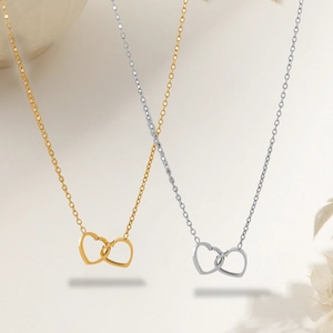 Minimalist double interlocking heart necklace in gold and silver stainless steel