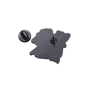 Detail view of the black enamel pin back with rubber butterfly clutch and metal spur