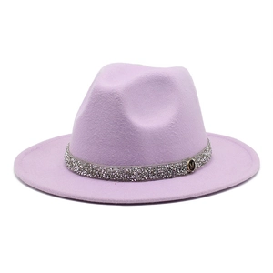 Detail of light purple wool fedora hat featuring rhinestone band and gold M logo buckle