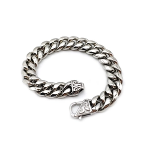 Polished silver stainless steel Cuban link bracelet with engraved vine clasp on white background