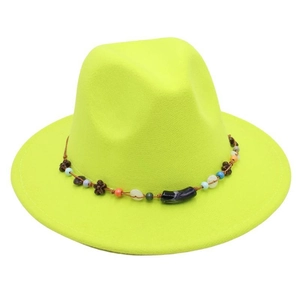 Detailed view of the neon green wool fedora with exquisite handmade beaded flower band