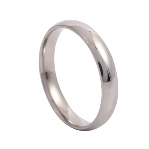 Macro shot of 2mm silver stainless steel smooth ring with polished arc surface finish