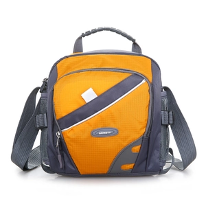 Detail of orange and grey hiking bag showing water bottle mesh pocket and layered zippers