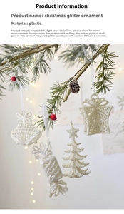 Glittery white Christmas pendants with bell and tree shapes hanging on pine branches